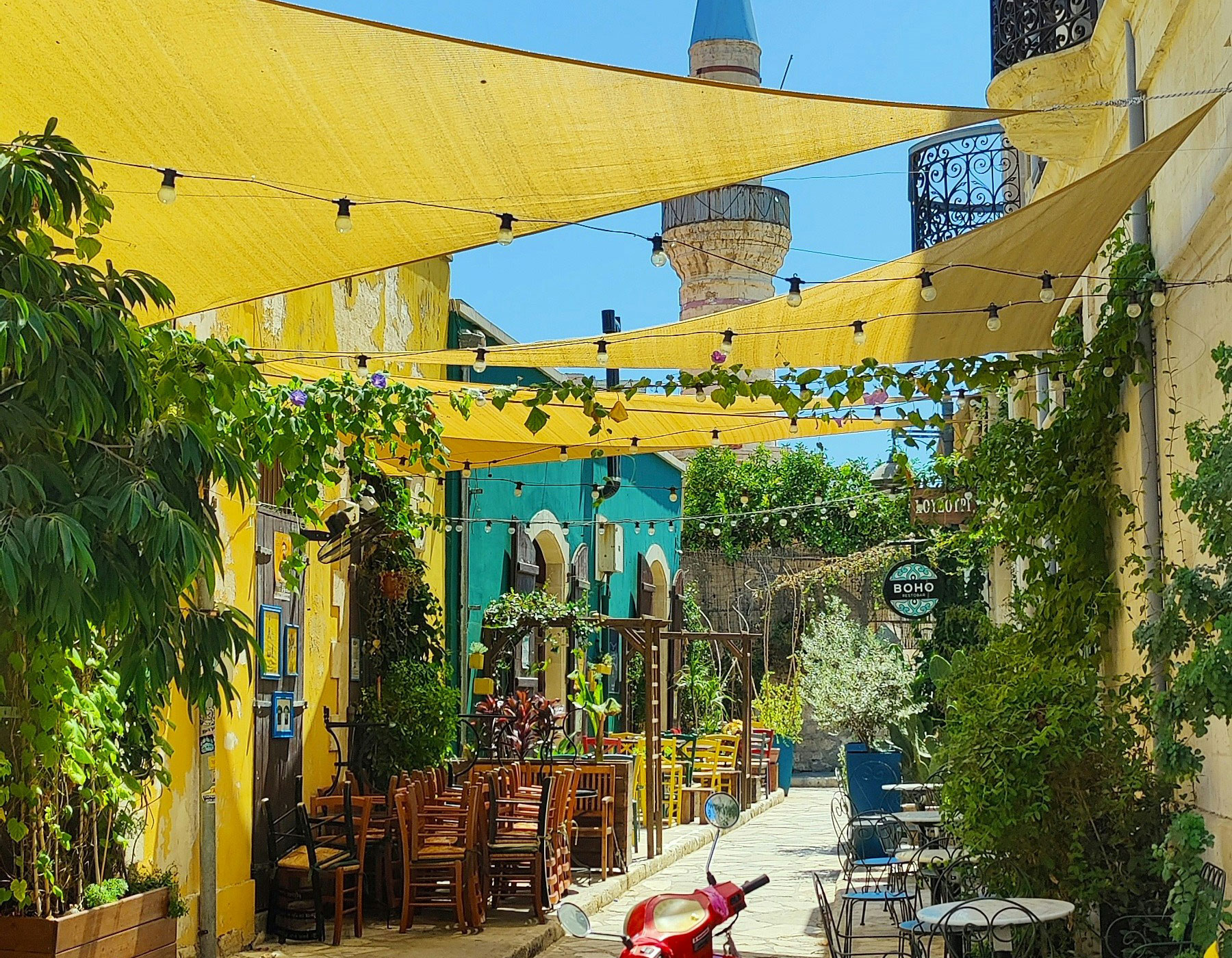 narrow street with cafes and wine bars in Limassol