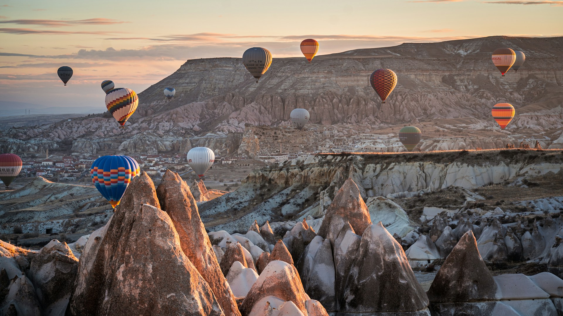 hot air balloons over Cappadocia at sunrise